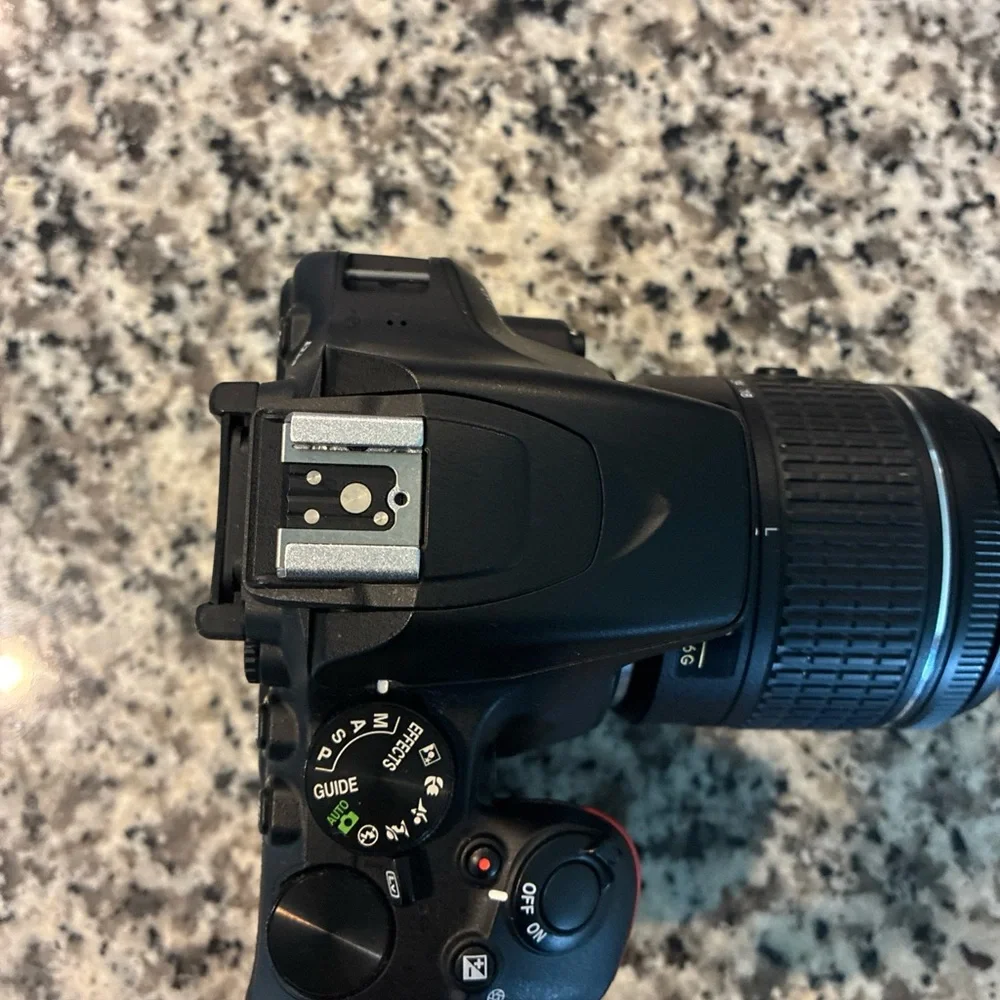 Nikon Black Digital Camera with Ergonomic Design and Professional Lens